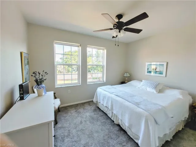 Bedroom featuring carpet and ceiling fan