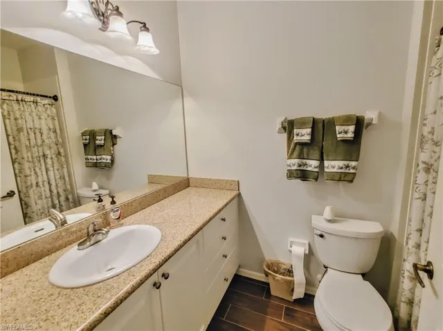 Bathroom featuring vanity and toilet