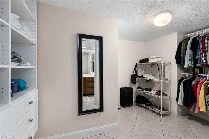 Walk in closet featuring light tile patterned flooring