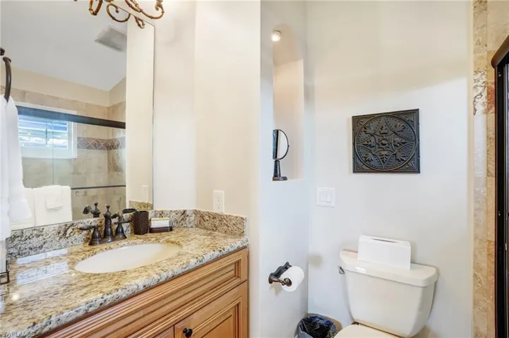Full bathroom featuring vanity and a stall shower - Virtually Edited Image