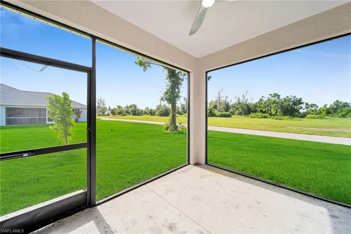 Unfurnished sunroom with ceiling fan