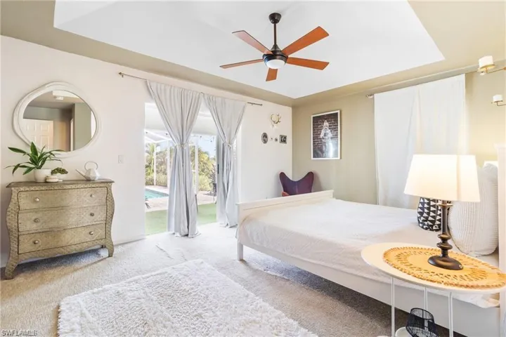 Main bedroom with view of pool