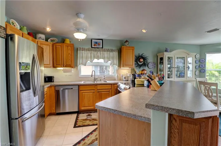 Kitchen with lots of lighting, counter space, pantry, and cabinets