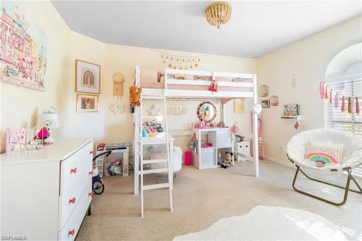 Bedroom 2 with ceiling fan and shelved closet