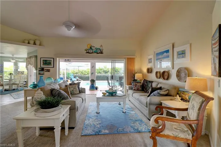 Open floorplan great room with oversized pocket sliders to pool