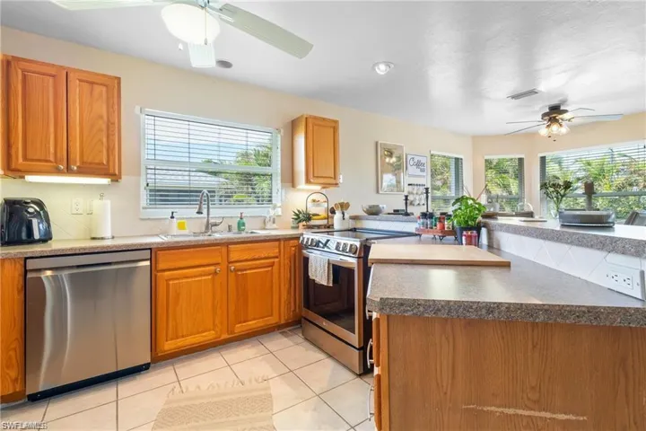Kitchen with lots of cabinets, open to great room and eat-in kitchen