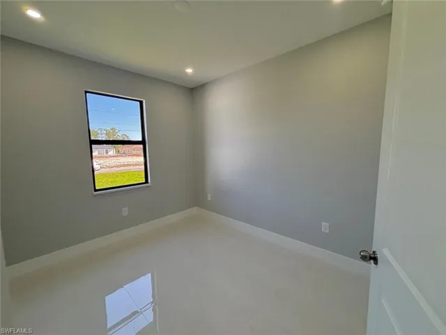 Empty room featuring recessed lighting