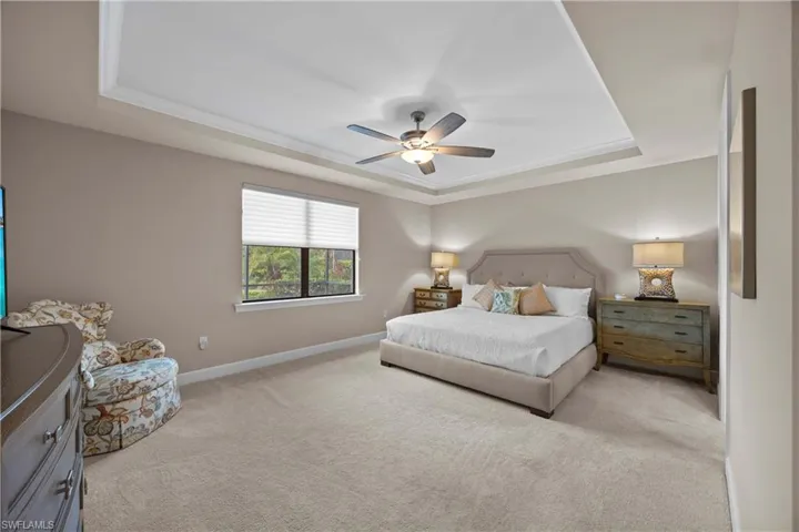 Owner Suite With Sitting Area And Tray Ceiling