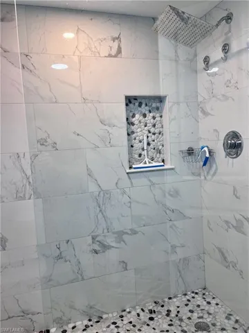 Bathroom with tiled shower