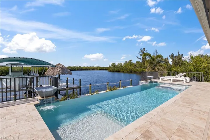 Built by Artesian Pools, this is the perfect place to spend your days swimming and enjoying the beauty of your natural surroundings - there is an osprey nest that is visible from the property and an abundant fishing mecca right in your back yard!