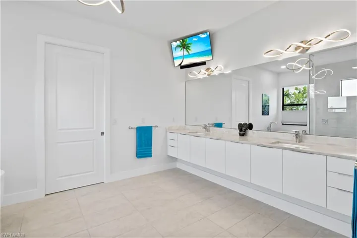 Welcome to your spa like master bathroom retreat!  Dual sinks, wheelchair accessible and gorgeous designer lighting.