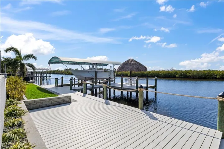 In addition to the 14,000 pound boatlift and tiki bar, you can easily have an additional outdoor living space on the expansive dock - plenty of room to add another lift or floating dock as well!