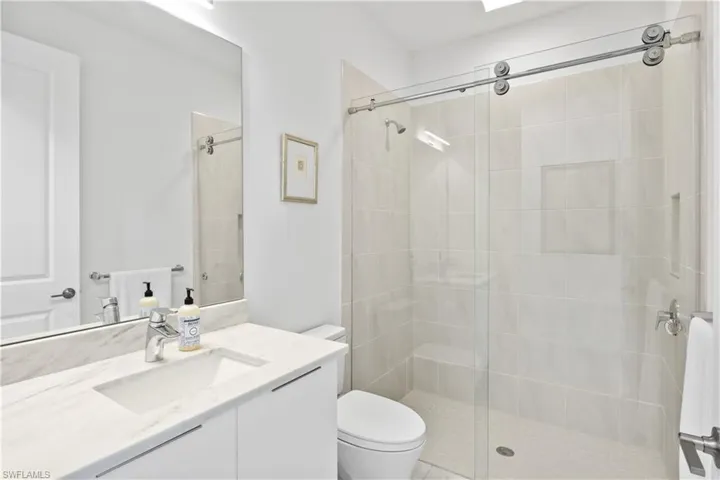 Junior master bathroom attached to the guest bedroom in the front of the home.
