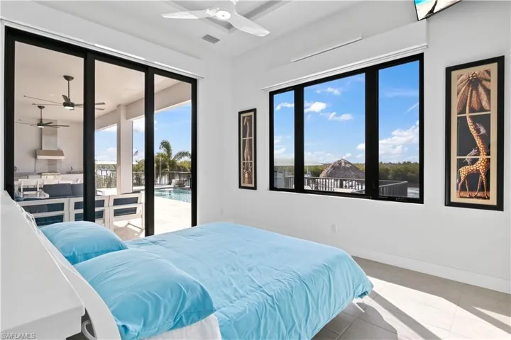 The views from the master bedroom towards the water!  There are two Lutron electronic shades - one is a blackout shade for full privacy and the other is a sheer - you can see out, they cannot see in during the day!