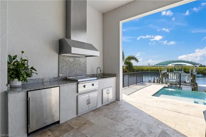 Outdoor flat top grill, fridge and sink!