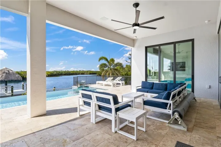 View looking into the master bedroom from the patio and also out to the water.