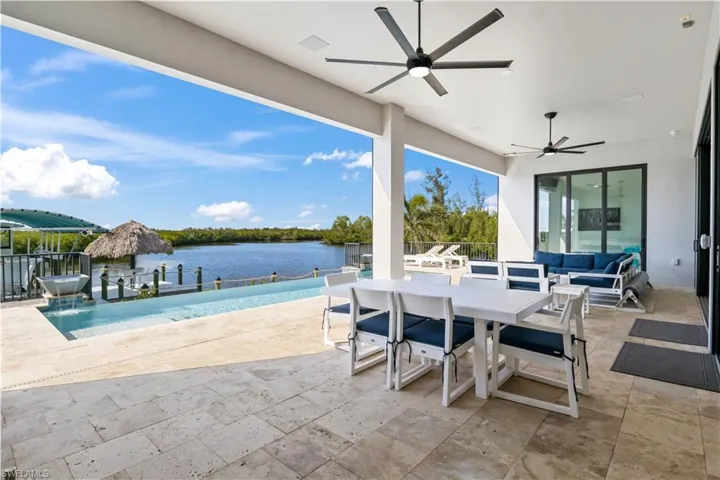 Expansive outdoor patio with those million dollar views!  Travertine tile throughout the entire perimeter and a custom quality pool and spa!  Retractable Kevlar screens across the entire width of the patio,