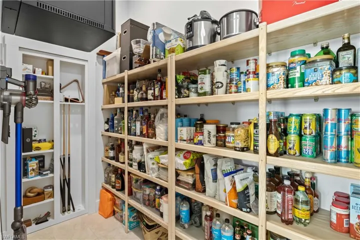 Every great home deserves an exceptional pantry/storage area and this is no exception - tucked away behind some faux doors and also features an additional "safe room".