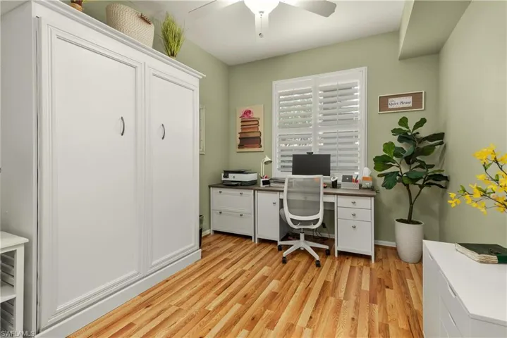 Office area featuring ceiling fan and light hardwood / wood-style floors