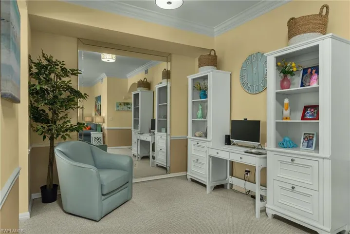 Carpeted home office featuring ornamental molding