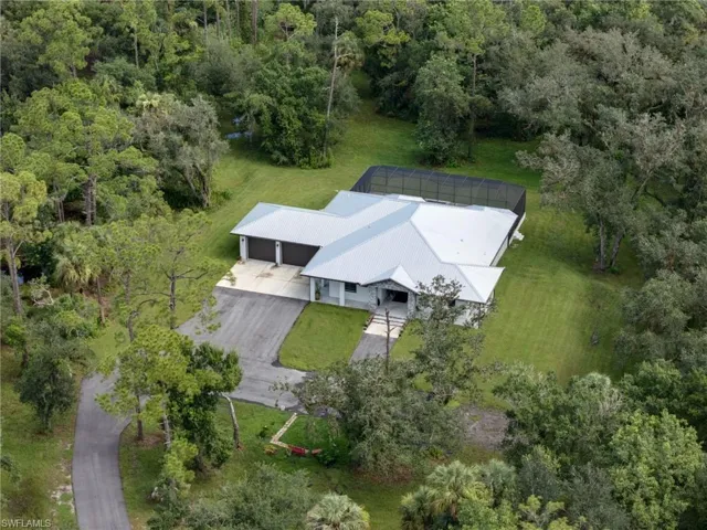 Aerial overview of property's location featuring a forest