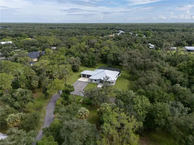 View of property location featuring a heavily wooded area