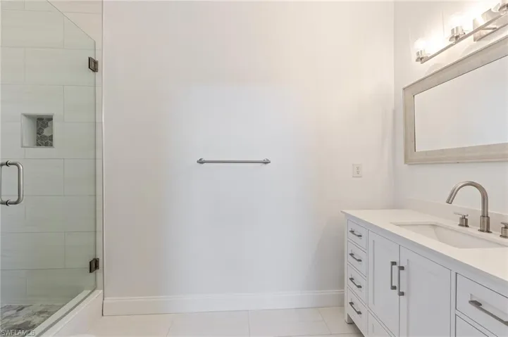walk in shower in this completely remodeled bathroom