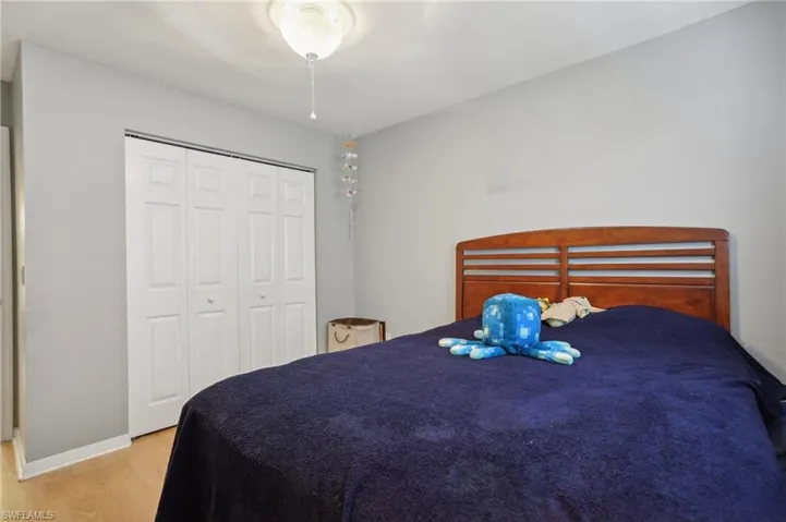 Bedroom featuring light hardwood / wood-style floors and a closet