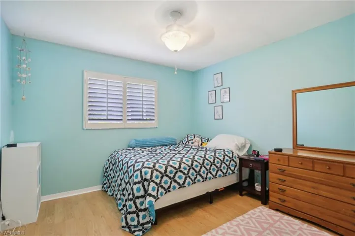 Bedroom with light wood-type flooring and ceiling fan