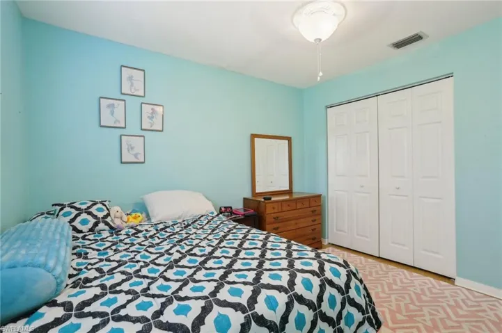 Bedroom with a closet and ceiling fan