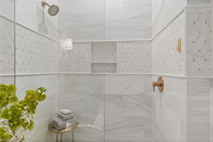 Bathroom featuring tiled shower