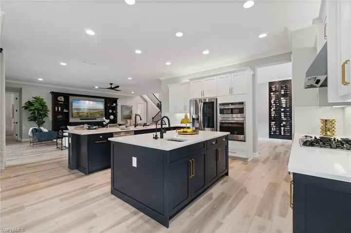 The chefs kitchen layout   boasts convenient and luxurious large peninsula with seating and a prep Island with second sink.