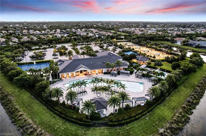Aerial perspective of the vast community ammenity area with swimming, multiple courts, play and fitness areas.Basketball, Billiards, Community Park, Community Pool, Community Room, Community Spa/Hot tub, Exercise Room, Lap Pool, Pickleball, Play Area, walking paths, Tennis Court, Volleyball.