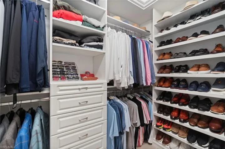 Duel custom California closets installed in primary suite. His and hers are adjacent to eachother and situated between the spa like bath and expansive bedroom suite.