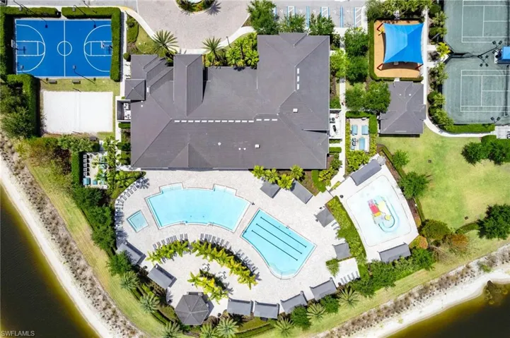 Bird's eye view the main amenity area highlighting the family friendly and lap pools, a portion of the numerous racket courts and water slides.