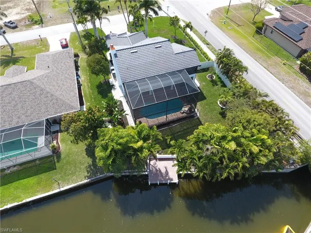 Rear Aerial View of Waterway and 2 story Home