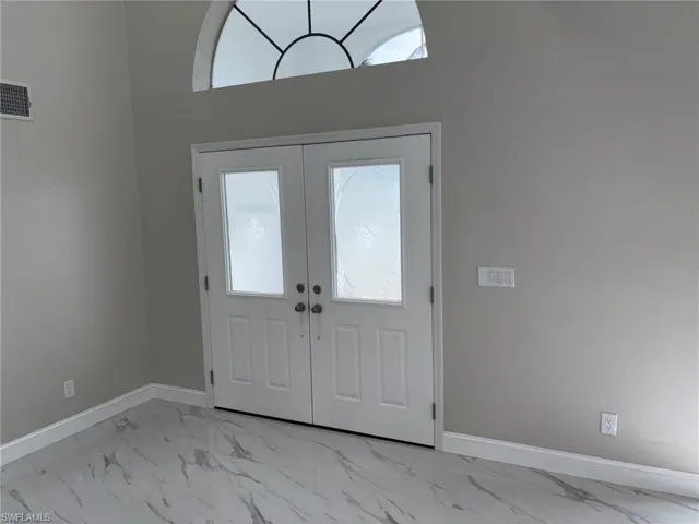 Entry Foyer with Custom double doors
