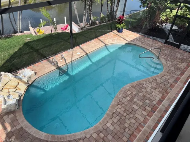 View of Pool and Backyard from 2nd floor covered balcony