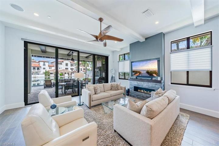 Great room with gas fireplace and stacking sliders to patio