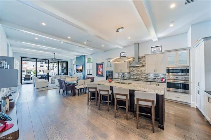 Continuous entertainment space from kitchen to dining to great room to patio