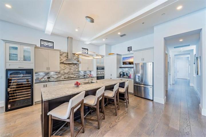 Chef's Kitchen with Viking appliances, dishwashing drawers, and tall EuroCave wine cooler