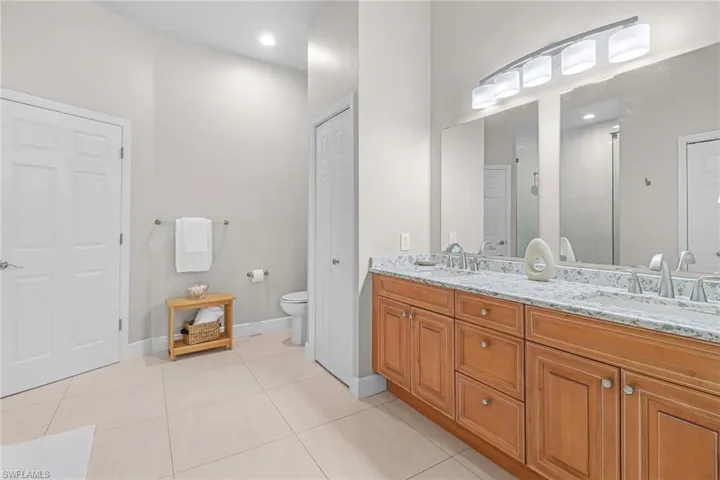 Spacious Master Bathroom with Double Sinks, granite countertops
