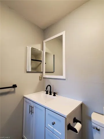 Bathroom featuring vanity and toilet