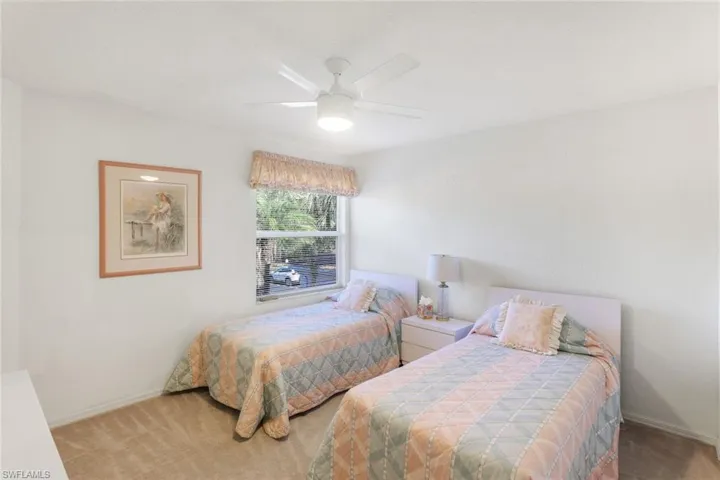 Bedroom with carpet and ceiling fan