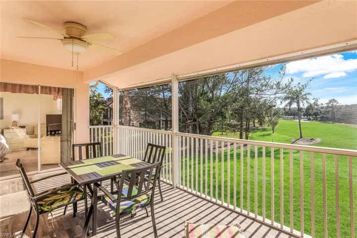 Sunroom / solarium with a ceiling fan, outdoor dining area, and a balcony