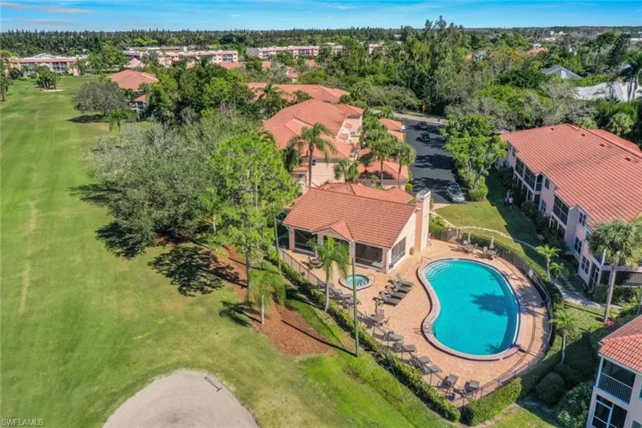 Aerial perspective of suburban area with a pool area