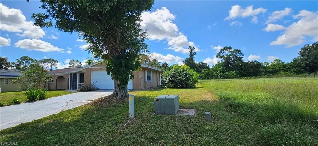 View of yard featuring a garage