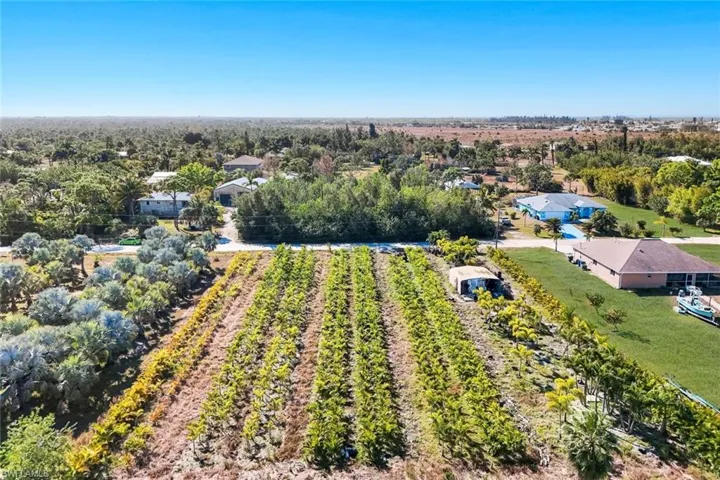Aerial overview of property's location featuring rural landscape and abundant farmland