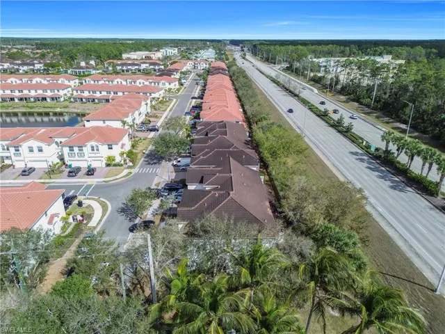 Aerial perspective of suburban area with a large body of water