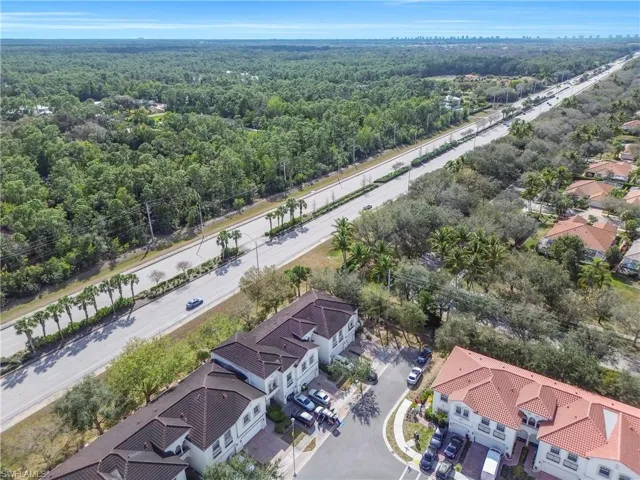Aerial perspective of suburban area with a heavily wooded area
